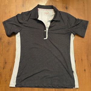 Cracked Wheat black and white polka dotted golf shirt.